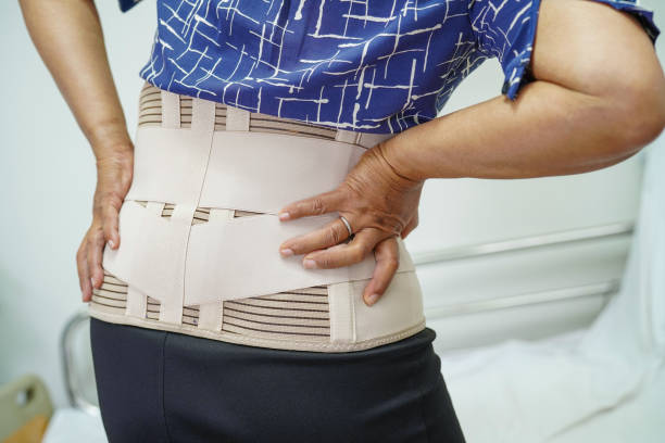 istock Asian senior wearing elastic support belt can help reduce back pain. 1407529095