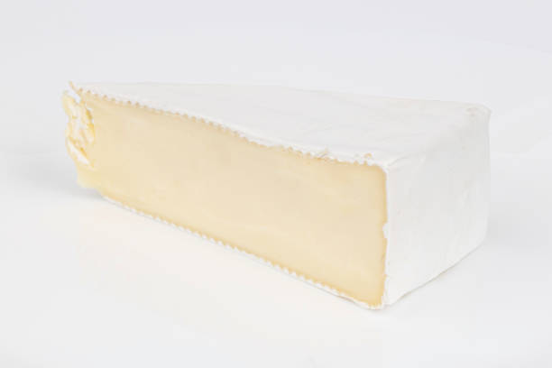 istock Soft brie cheese on a white background, a piece of dairy delicacy. 1407535748