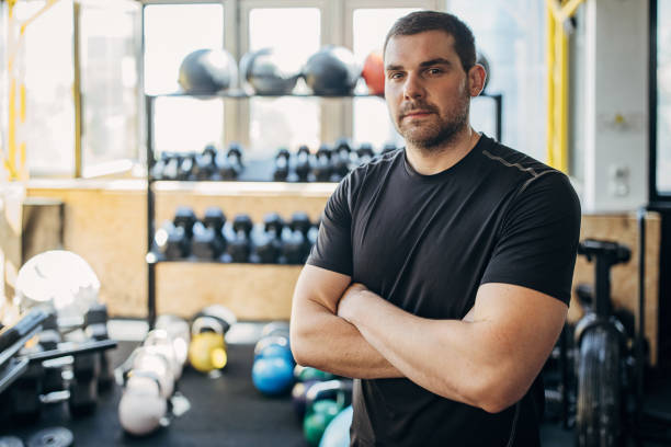 istock Fit man in gym 1407535858