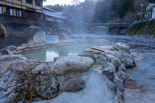An open-air bath called crab hot water in the early morning when the warm steam of Nagayu Onsen in Oita Prefecture rises