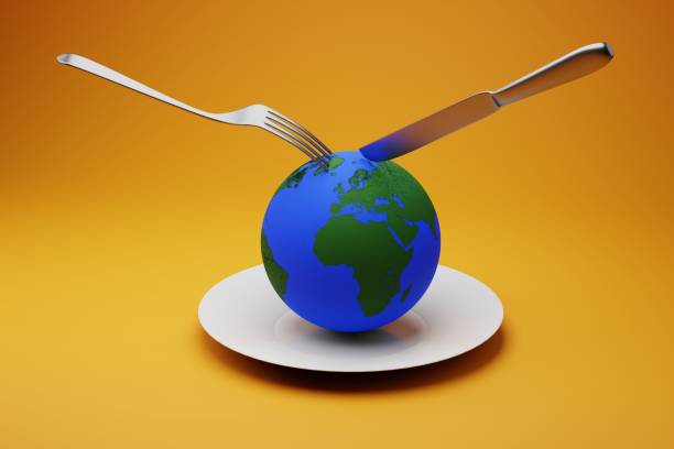istock food crisis on the planet concept. globe on a plate and a fork with a knife. 3D render. 1407537943