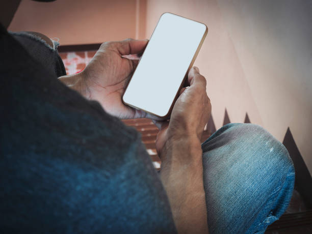istock Mockup white screen cell phone. hand people man holding using mobile phone with blank screen mock up background for advertise marketing business. Concept marketing on smartphone. 1407539450