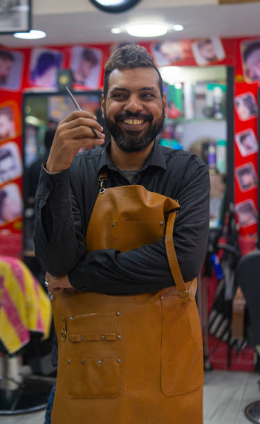 Happy barber arab man portrait with scissors