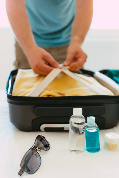 istock Packing suitcase for travel vacation in new normal 1407542195