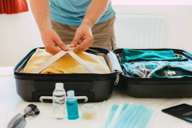 istock Packing suitcase for travel vacation in new normal 1407542703