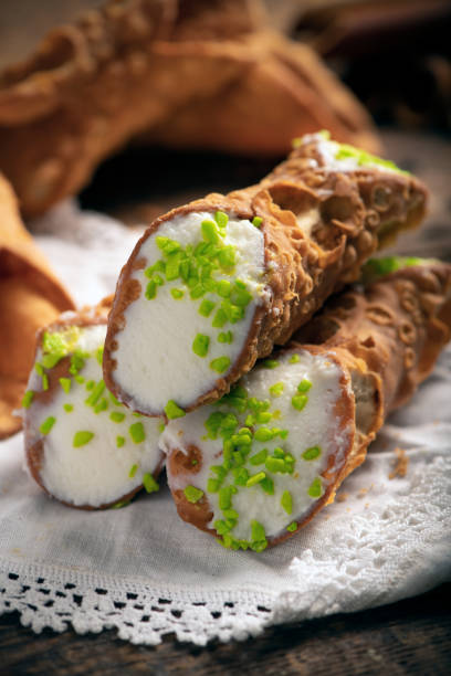 istock Freshly baked sicilian Cannoli dusted with powdered sugar 1407546855
