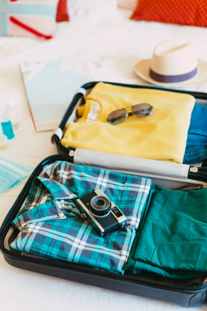 istock Packing suitcase for travel vacation in new normal 1407547278