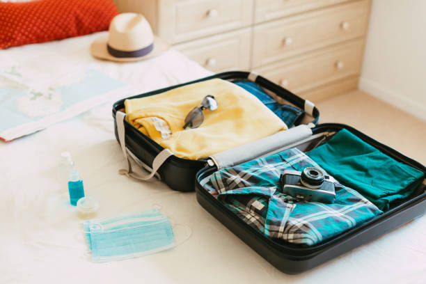 istock Packing suitcase for travel vacation in new normal 1407547281