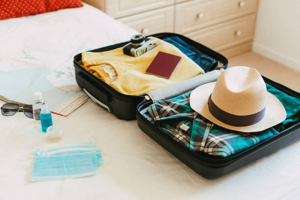 istock Packing suitcase for travel vacation in new normal 1407547282