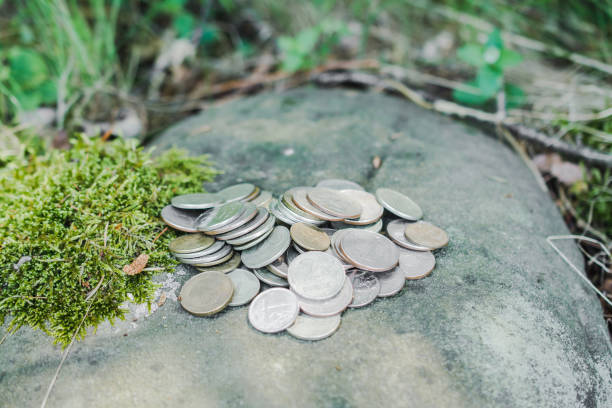 istock A pile of coins on a rock 1407548688