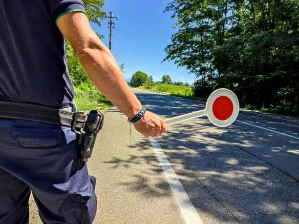 Photo of Policeman with a paddle close-up