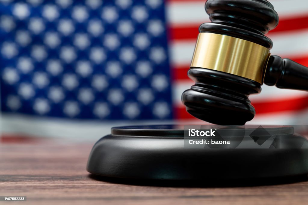 Wooden gavel and American flag Wooden gavel and American flag. Gavel Stock Photo