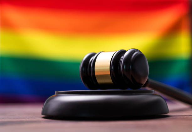 istock Wooden gavel and Rainbow flag 1407552340