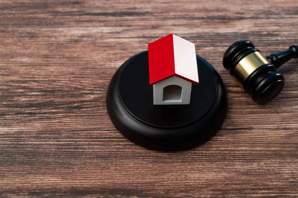 istock Gavel and model house on the table 1407552464
