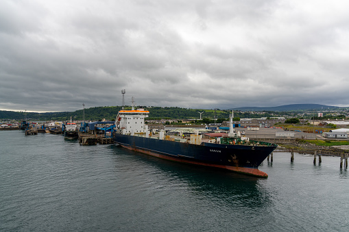 Larne, United Kingdom - 6 July, 2022: view of the industrial port and ferry harbor of Larne on the coast of Norther Ireland