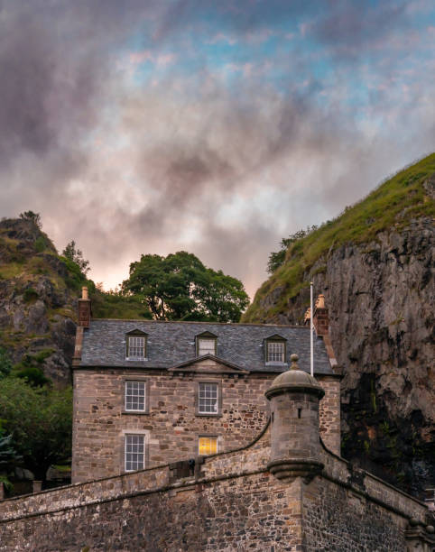vertical view of Dumbarton Castle and Dumbarton Rock on the Clyde River at sunset Dumbarton, United Kingdom - 4 July, 2022: vertical view of Dumbarton Castle and Dumbarton Rock on the Clyde River at sunset dumbarton castle stock pictures, royalty-free photos & images