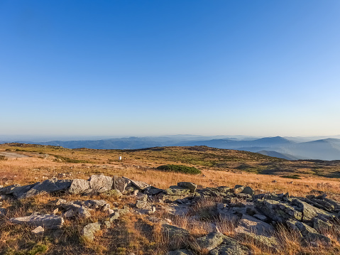 Mountain landscape at Torre, Serra da Estrela, Portugal. View of the mountain chain and golden grass.