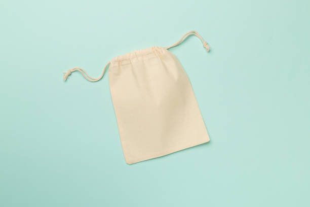 istock Small eco sack on color background. Top view 1407555781