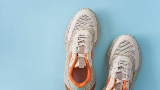 istock Colorful shoes on the blue backround 1407560287