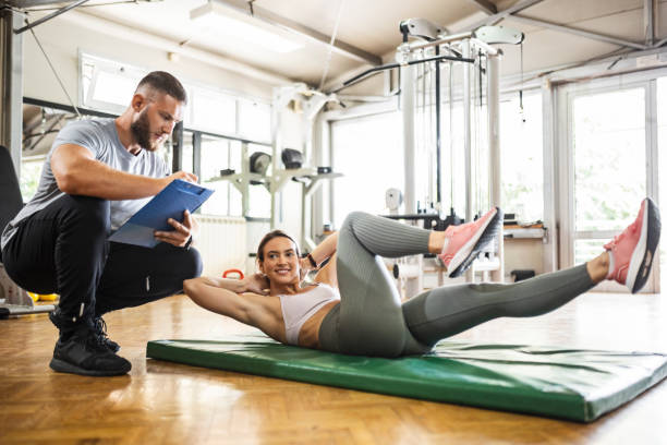 istock Coach having sports training with young woman 1407561814