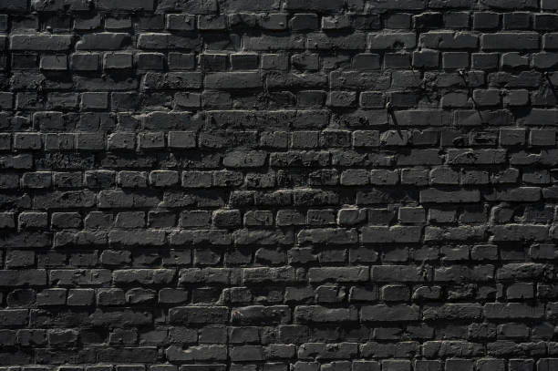 istock Old black brick wall texture ,brick wall texture for interior design vintage dark tone. 1407565238