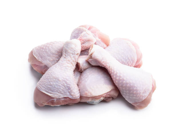 istock Raw chicken legs isolated on white 1407565346