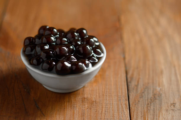 istock Black pearls. Boiled tapioca pearls for bubble tea 1407565457