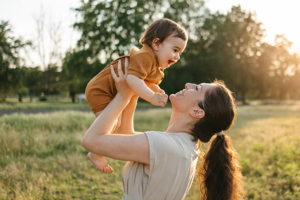 istock Mom holding her baby 1407570793