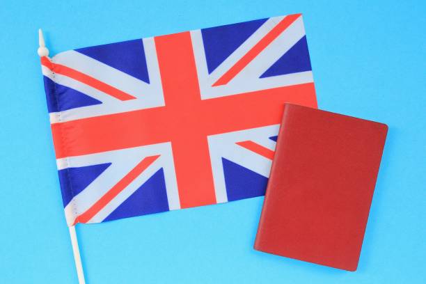 istock Passport and flag of Great Britain on blue background 1407571105