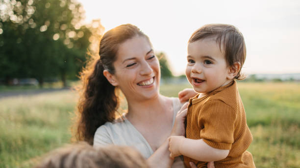 istock Mom holding her baby 1407571276
