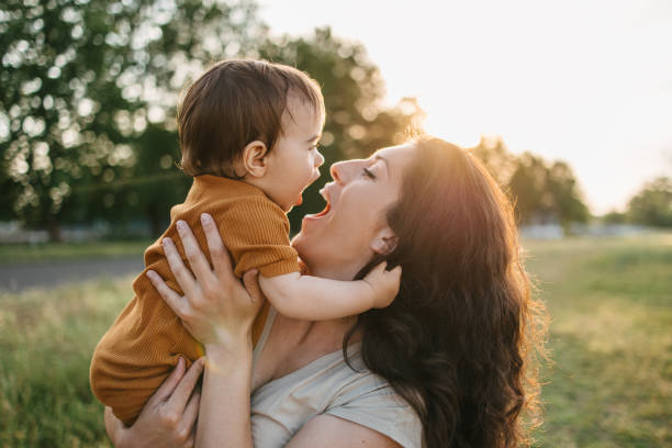 istock Mom holding her baby 1407571874