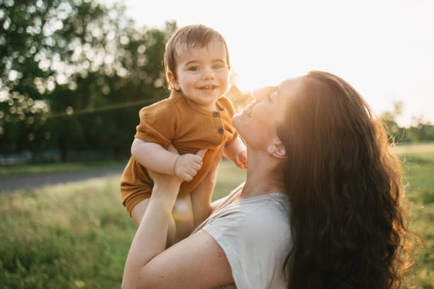 istock Mom holding her baby 1407571911