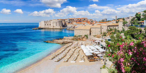 Landscape with Dubrovnik town, Croatia Landscape with Banje beach and old town of Dubrovnik, dalmatian coast, Croatia dubrovnik walls stock pictures, royalty-free photos & images