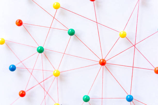 istock Linking entities, Blockchain, social media, Communications Network, The connection between the two networks. Network simulation on paper linked together by yarn 1407582392