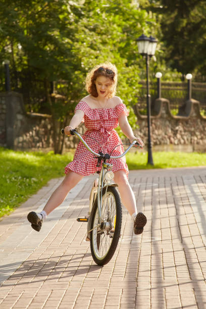 istock girl on bike 1407582646