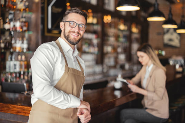 istock Coffee Shop Owner Smiling at Camera 1407583558