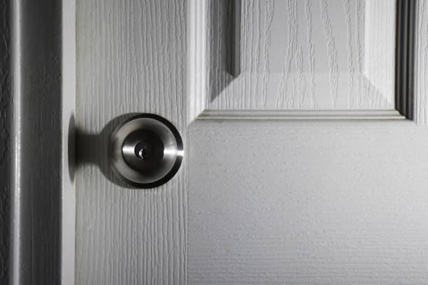 istock Door, metallic circle doorknob and lock 1407584660