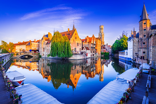 Bruges, Belgium. Golden hour landscape with beautiful Rozenhoedkaai in Brugge, famous Flanders landmark.