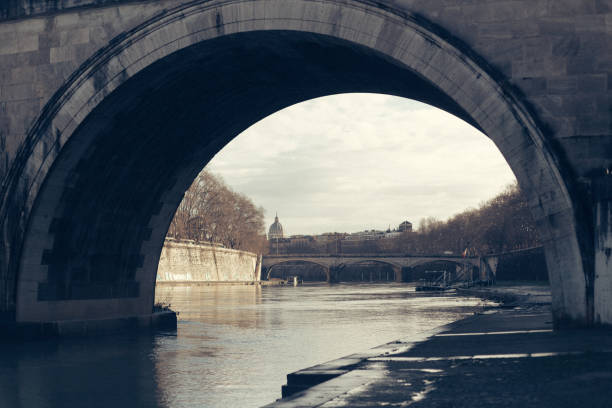istock Under the bridge in Tiber river in Rome, Italy 1407590129