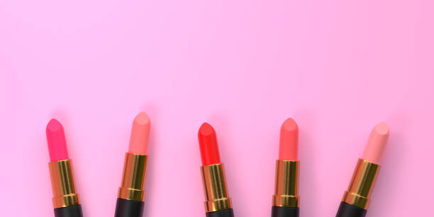 istock Lipsticks close-up on a pastel pink background with copy space 1407591238