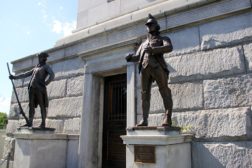 Battle Monument, commemorates the December 26, 1776 Battle of Trenton, dedicated in 1893, sculptures of soldiers guarding the entrance at the base, Trenton, NJ, USA