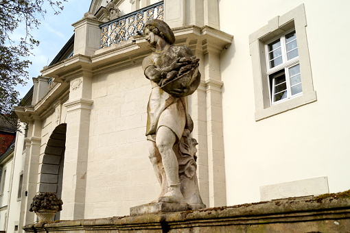 Schloss Fasanerie, palace complex from the 1700s, near Fulda, balustrade in inner courtyard with idyllic villagers sculptures, Eichenzell, Germany