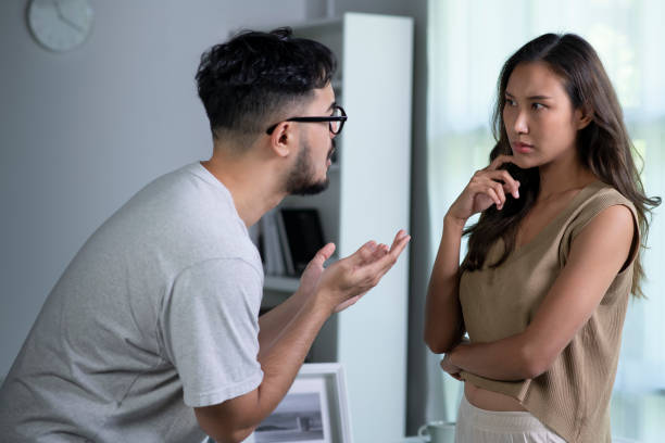 istock Asian couple arguing shouting blaming each other of problem. 1407604899