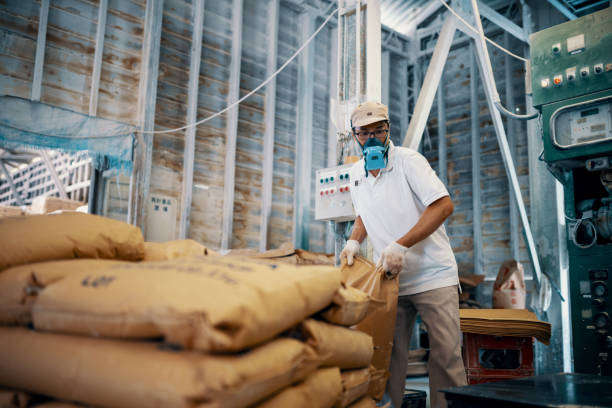 istock Mid adult man working in a factory 1407604970