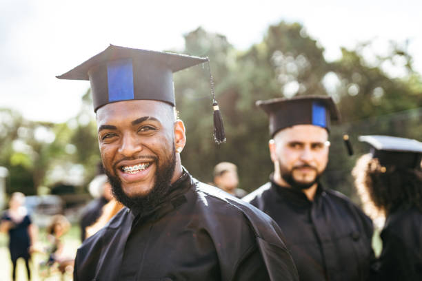 istock Smiling college student at graduation 1407609237