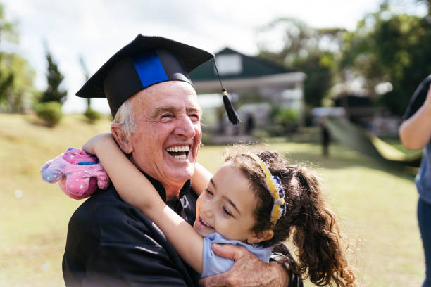 дедушка окончил школу - mortar board child female people стоковые фото и изображения