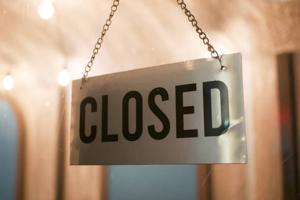 istock close sign hanging front of cafe . 1407615053