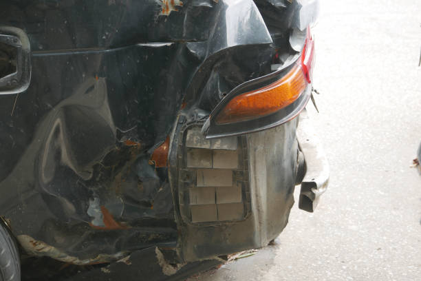 istock black car damaged by a road accident 1407615196