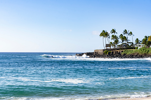 View of a paradisiacal beach in Oahu, Hawaii. Waimea Beach ia a popular snorkeling spot.
