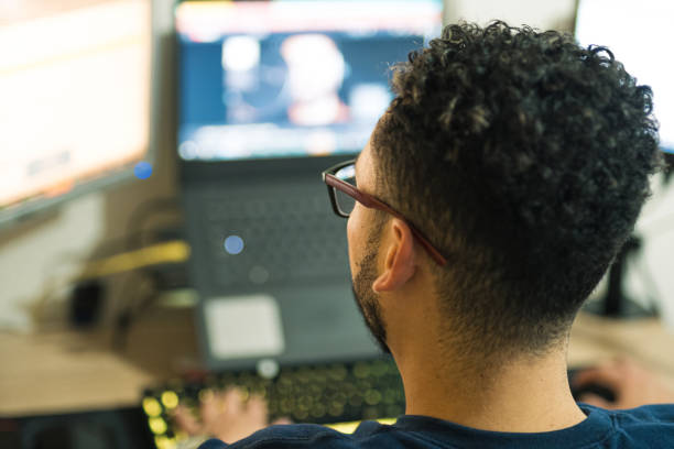 istock Freelance worker using his computer. Online jobs to generate extra income 1407617919